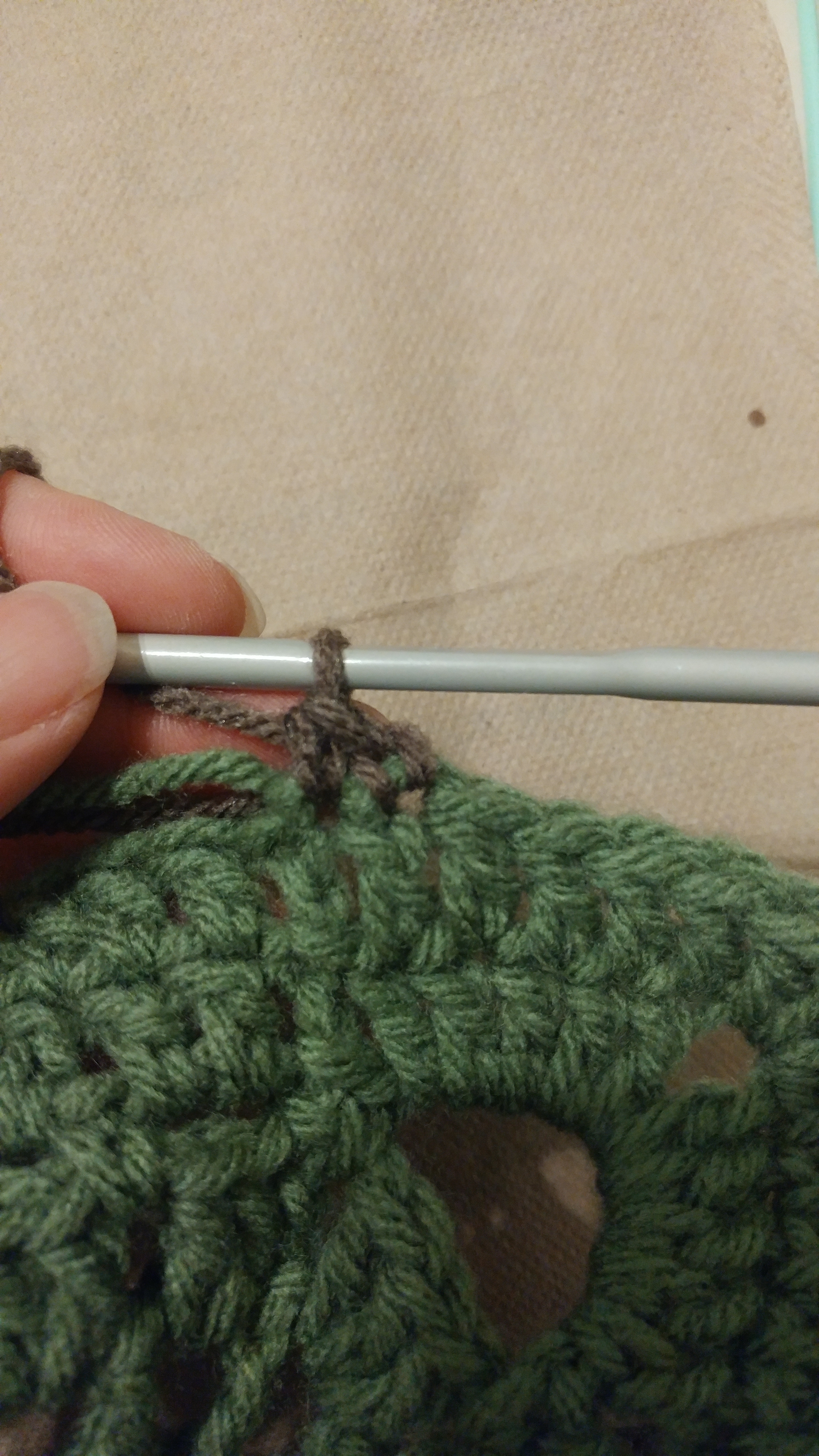 Fancy Square Border Start The connection and first two stitches of the walnut border on my green fancy square.