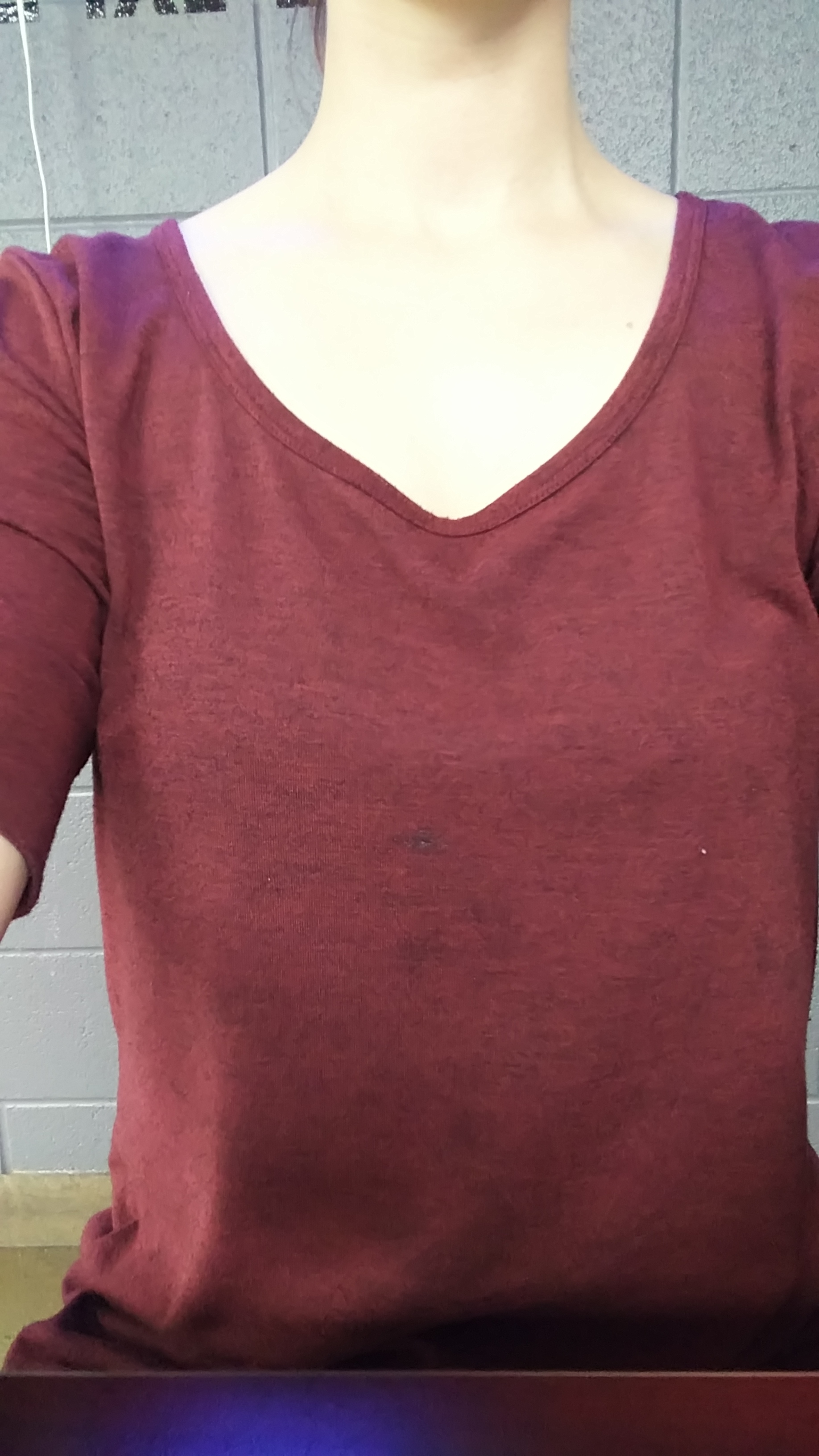 a burgundy shirt