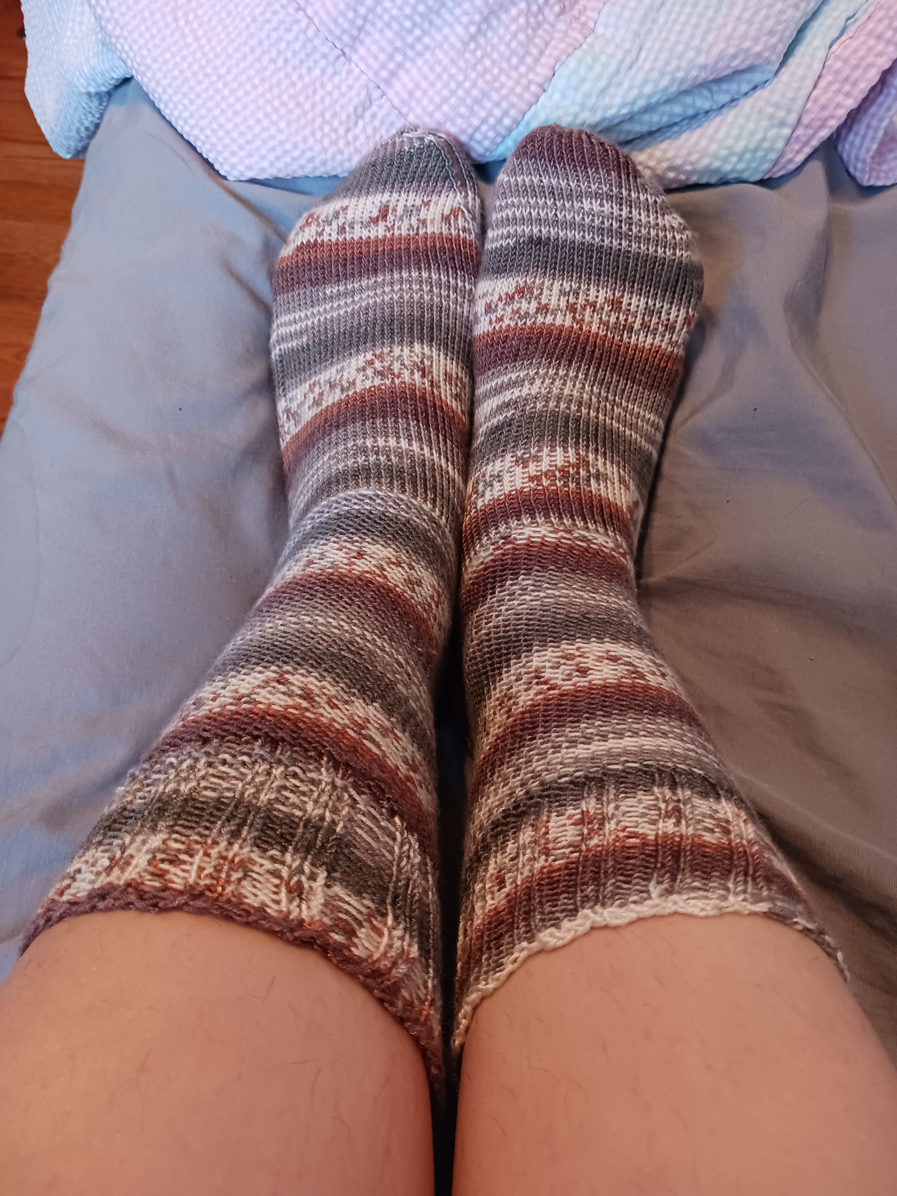 Wearing my hand-knitted socks Me wear the socks I knitted using self-striping yarn.